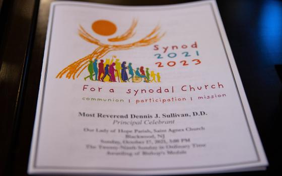 A program for a Mass opening the synod process in the Diocese of Camden, N.J., is seen at St. Agnes Church of Our Lady of Hope Parish Oct. 17, 2021, in Blackwood, New Jersey. Over several months reflections were collected from the faithful in parishes across the diocese and put before diocesan teams and deaneries as part of the churchwide preparation process for the 2023 world Synod of Bishops on synodality. (CNS/Catholic Star Herald/Dave Hernandez)