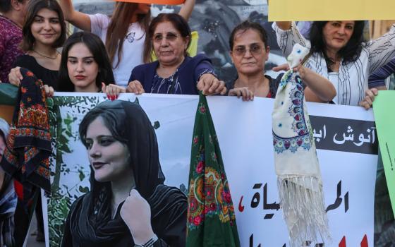 Women take part in a rally in Beirut Sept. 21, days after the Iranian authorities announced the death of Mahsa Amini, 22, who died after being arrested in Tehran for allegedly wearing a hijab or headscarf in an "improper" way. (CNS/Reuters/Mohamed Azakir)