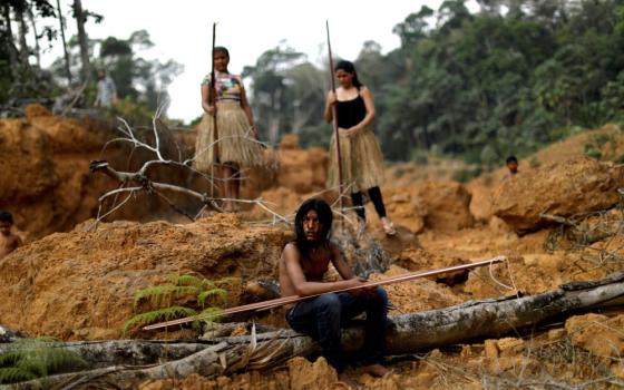 Young people from the Mura tribe are pictured in a file photo at a deforested area on unmarked Indigenous lands inside the Amazon rainforest near Humaita, Brazil. (CNS/Reuters/Ueslei Marcelino)