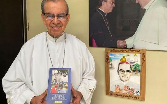 Salvadoran Cardinal Gregorio Rosa Chávez holds of copy of a book that addresses part of half a century of his life serving the Catholic Church in El Salvador Dec. 16, 2022, at St. Francis of Assisi parish in San Salvador. (CNS/Rhina Guidos)