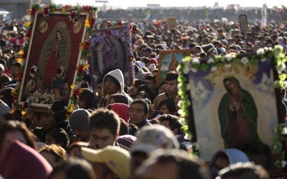 Pilgrims wait their turn to enter the Basilica of Guadalupe, in Mexico City, Dec. 12, 2013. Hundreds of thousands of people from all over the country converge on Mexico's holy Roman Catholic site, many bringing with them images or statues of Mexico's patron saint to be blessed, marking the Virgin's Dec. 12 feast day. (AP Photo/Eduardo Verdugo, File)
