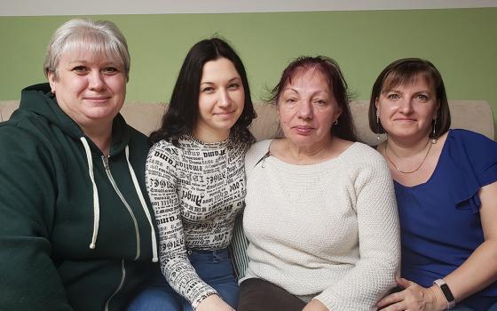 Four Ukrainian refugee women living in Jesuit seminary housing in Warsaw say they are ending a turbulent year safe, secure and calm — though still uneasily in exile. From left to right, the women are: Nadia Zhihalko, 46; Katya Zelinska, 27; Lubov Kadura, 67; and Yanyna Vasyk, 37. (NCR photo/Chris Herlinger)