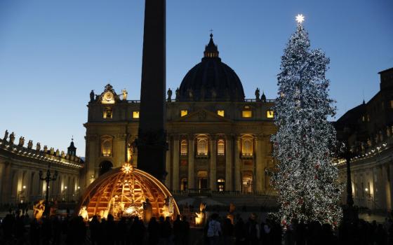 The Nativity scene and Christmas tree decorate St. Peter's Square at the Vatican Dec. 5. (CNS/Paul Haring)