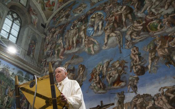 Pope Francis gives the homily in front of Michelangelo's fresco of the "Last Judgment" in the Sistine Chapel at the Vatican Jan. 9, 2022. (CNS photo/Vatican Media)
