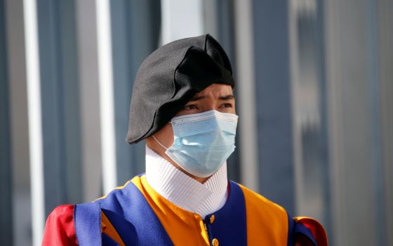 A Swiss Guard wearing protective face masks stands guard at the Vatican May 4, 2020. (CNS photo/Remo Casilli, Reuters)