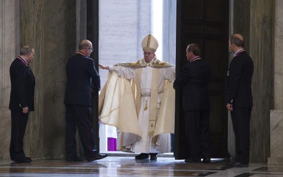 Pope Francis opens the Holy Door of St. Peter's Basilica to inaugurate the Jubilee Year of Mercy at the Vatican in this Dec. 8, 2015. (CNS photo/Vatican Media)