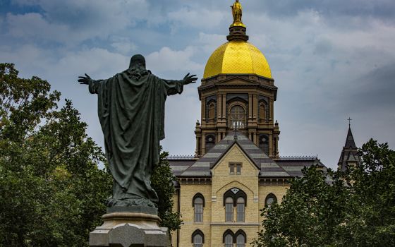 A statue of Jesus facing the Golden Dome with its statue of Mary atop the administration building of the University of Notre Dame in Notre Dame, Ind.,  Aug. 6, 2021. (CNS photo/Chaz Muth)