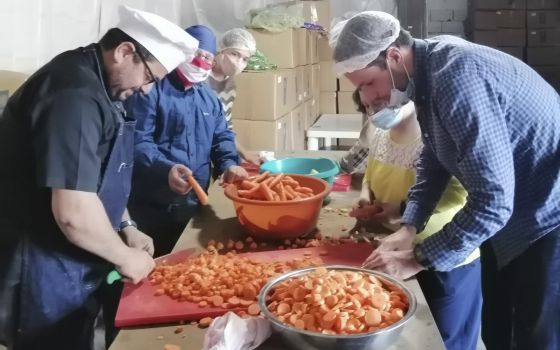 Maronite Father Hani Tawk and a team of volunteers prepare to cook meals for the needy at Mary's Kitchen in the blast-stricken neighborhood of Karintina in Beirut Nov. 24, 2020. (CNS photo/Doreen Abi Raad)
