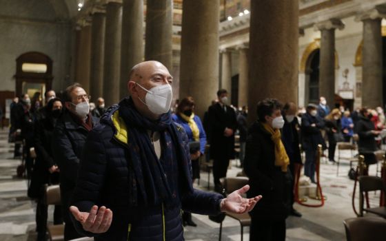 People pray during an evening prayer service hosted by the Community of Sant'Egidio at the Basilica of Santa Maria in Trastevere in Rome Feb. 24, 2022. (CNS photo/Paul Haring)