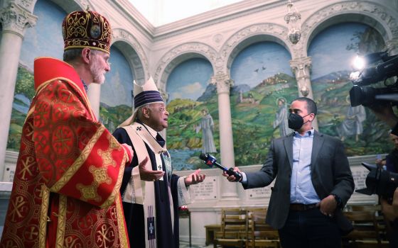 Washington Cardinal Wilton D. Gregory responds to reporters after an Ash Wednesday Mass at St. Matthew's Cathedral in Washington March 2, 2022. Also pictured is Archbishop Borys Gudziak of the Ukrainian Catholic Archeparchy of Philadelphia. (CNS photo)