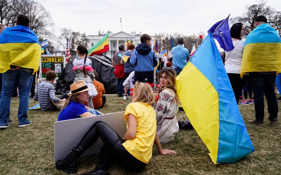 People near the White House in Washington gather for a protest March 6, against Russia's invasion of Ukraine. (CNS/Reuters/Sarah Silbiger)