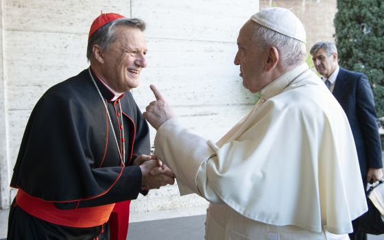 Pope Francis greets Maltese Cardinal Mario Grech, secretary-general of the Synod of Bishops, during a meeting with representatives of bishops' conferences from around the world at the Vatican in this Oct. 9, 2021. (CNS photo/Paul Haring)