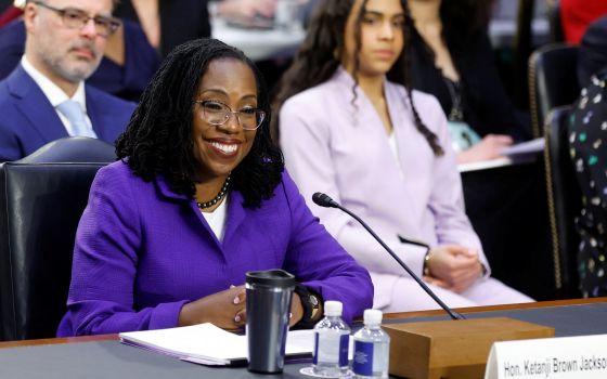 Supreme Court nominee Ketanji Brown Jackson, a federal appeals court judge, smiles as she listens to the start of the U.S. Senate Judiciary Committee confirmation hearing on her nomination to the U.S. Supreme Court on Capitol Hill in Washington March 21, 