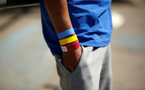 Bracelets used by the U.S. Border Patrol are seen on the arm of a Central American migrant near the Paso del Norte international border bridge in Ciudad Juarez, Mexico, Oct. 1, 2021.