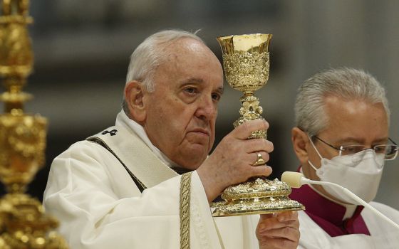 Pope Francis celebrates the Eucharist during Holy Thursday chrism Mass in St. Peter's Basilica at the Vatican April 14. (CNS/Paul Haring)