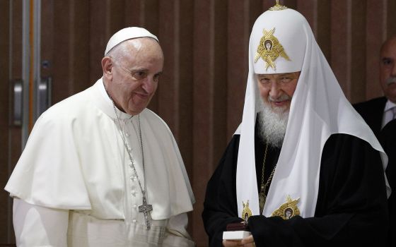 Pope Francis presents gifts to Russian Orthodox Patriarch Kirill of Moscow after the leaders signed a joint declaration during a meeting at Jose Marti International Airport in Havana in this Feb. 12, 2016, photo. (CNS photo/Paul Haring)