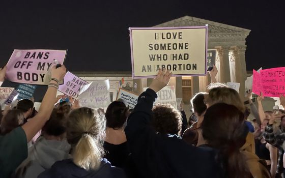 People in Washington react outside the U.S. Supreme Court May 2, 2022. (CNS photo/Moira Warburton, Reuters)