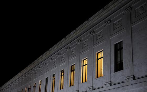 Lights burn inside U.S. Supreme Court offices May 2 in Washington, after the leak of a draft majority opinion written by Justice Samuel Alito preparing for a majority of the court to overturn the Roe v. Wade abortion rights decision later this year. (CNS)