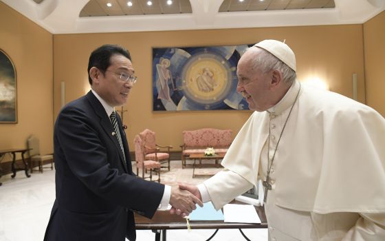 Pope Francis shakes hands with Japanese Prime Minister Fumio Kishida during a private audience at the Vatican May 4, 2022. (CNS photo/Vatican Media)