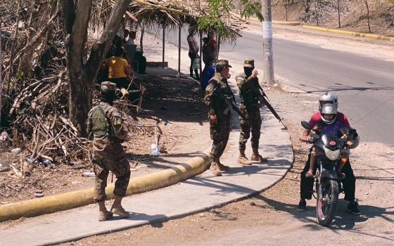 Armed Salvadoran soldiers arrive at an intersection to set up surveillance near El Paraiso in northern El Salvador April 23, 2022. (CNS photo/Rhina Guidos)