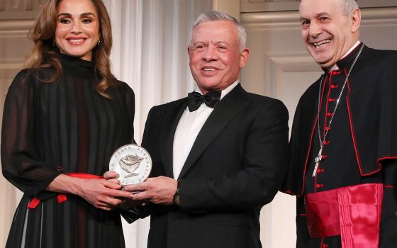 Archbishop Gabriele Caccia, the Vatican's permanent observer to the United Nations, presents the Path to Peace Award to Jordan's King Abdullah II and his wife, Queen Rania, May 9, 2022, in New York City. (CNS photo/Joe Vericker via Permanent Observer Miss