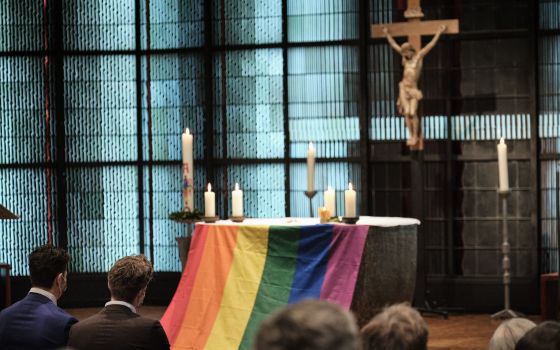 The altar is draped with a rainbow flag during the blessing service "Love Wins" in the Church of St. Martin in Geldern, Germany, May 6, 2021. (CNS photo/Rudolf Wichert, KNA)