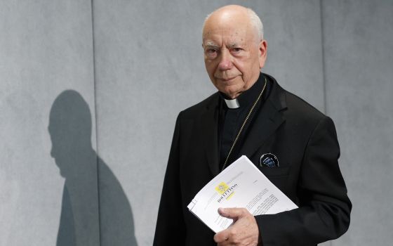 Cardinal Francesco Coccopalmerio, then-president of the Pontifical Council for Legislative Texts, arrives for a news conference at the Vatican in this Sept. 8, 2015.  (CNS photo/Paul Haring)