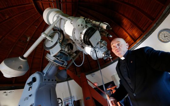 Jesuit Fr. Gabriele Gionti, an astronomer, talks about a 1935 Zeiss telescope during a tour for media representatives of the Vatican Observatory at the papal villa at Castel Gandolfo, Italy, in this Sept. 28, 2018, file photo. (CNS/Paul Haring)