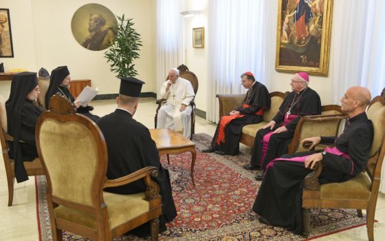 Pope Francis listens to Orthodox Archbishop Job of Telmessos while meeting a delegation representing the Ecumenical Patriarchate of Constantinople at the Domus Sanctae Marthae at the Vatican June 30 (CNS/Vatican Media)