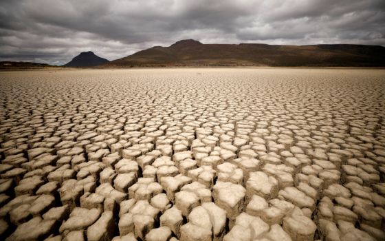 Clouds gather but produce no rain as cracks are seen in the dried-up municipal dam in drought-stricken Graaff-Reinet, South Africa, Nov.14, 2019. (CNS/Reuters/Mike Hutchings)