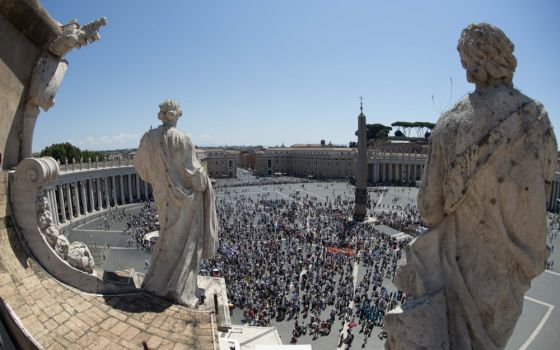 People in St. Peter's Square attend the Angelus led by Pope Francis from the window of his studio overlooking the square at the Vatican July 17. (CNS/Vatican Media)