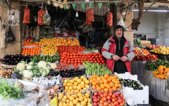 A vendor sells vegetables at a market in Damascus, Syria, March 18, 2022. In a video message released by the Pope's Worldwide Prayer Network Aug. 2, Pope Francis offered his August prayer intention to small- and mid-sized business owners. (CNS photo/Firas