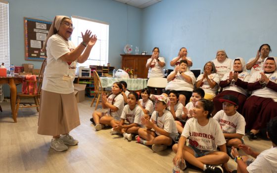 Teresian Sister Dolores Aviles speaks to children attending Camp I-CAN in Uvalde, Texas, July 25, 2022. 