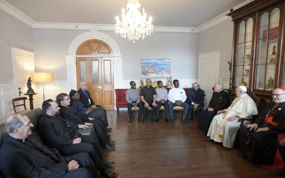 Pope Francis meets with Jesuits working in Canada during a meeting at the archbishop's residence in Quebec July 29, 2022. At right is Cardinal Michael Czerny, prefect of the Dicastery for Promoting Integral Human Development.