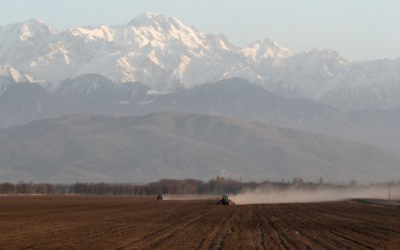 Agricultural workers operate tractors in a field in the Almaty region of Kazakhstan April 6. Pope Francis is scheduled to visit Kazakhstan Sept. 13-15 to attend the Congress of World and Traditional Religions. (CNS photo/Reuters/Pavel Mikheyev)