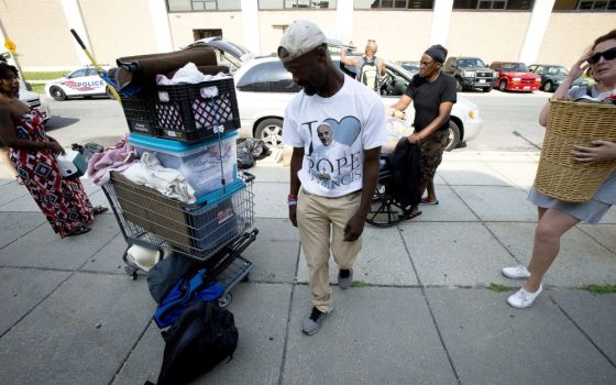 Eric Sheptock, an advocate for the homeless in Washington, helps other people move their belongings June 22, 2017, after police told them they had to move.
