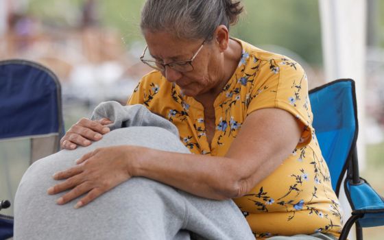 Annie Sanderson comforts her granddaughter Sept. 5, 2022, after a stabbing spree left at least 11 people in the James Smith First Nation and in the nearby town of Weldon, Saskatchewan.