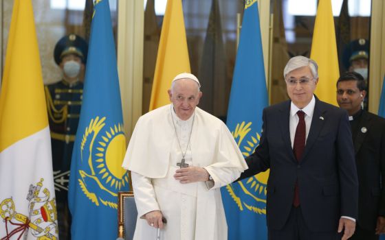 Pope Francis is welcomed by Kazakh President Kassym-Jomart Tokayev as he arrives at the international airport in Nur-Sultan, Kazakhstan, Sept. 13, 2022. (CNS photo/Paul Haring)