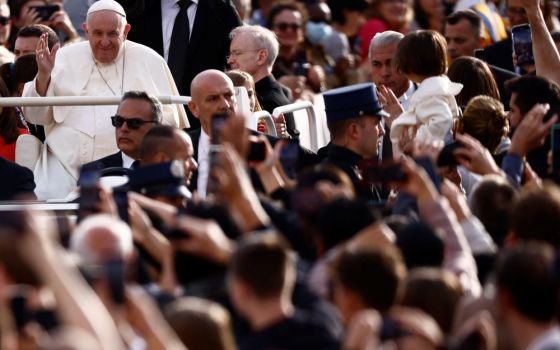 Pope Francis greets people during his general audience in St. Peter's Square at the Vatican Sept. 28, 2022. (CNS photo/Yara Nardi, Reuters)