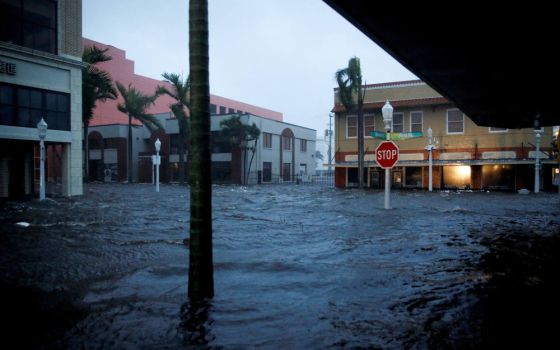 Floodwaters cover a road after Hurricane Ian made landfall in Fort Myers, Fla., Sept. 28, 2022. (CNS photo/Marco Bello, Reuters)
