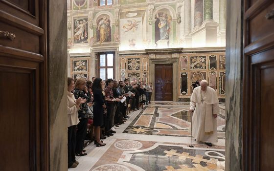 Pope Francis uses a cane as he leaves an audience with participants attending a conference promoting educational initiatives for migrants and refugees, Sept. 29 at the Vatican. (CNS/Vatican Media)