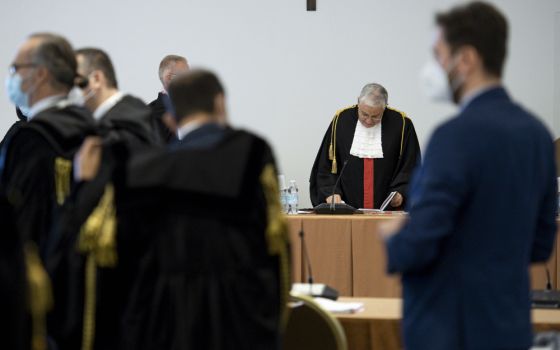 Judge Giuseppe Pignatone presides at the third session of the trial of six defendants accused of financial crimes, at the Vatican City State criminal court Nov. 17, 2021