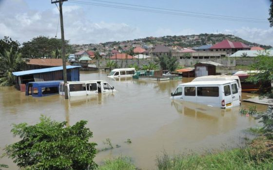 Vehicles are pictured in floodwaters Oct. 5, 2022, in a suburb of Accra, Ghana, after heavy rains caused spillage of the Weija dam. (CNS photo/courtesy St. Peter Church, Tetegu)