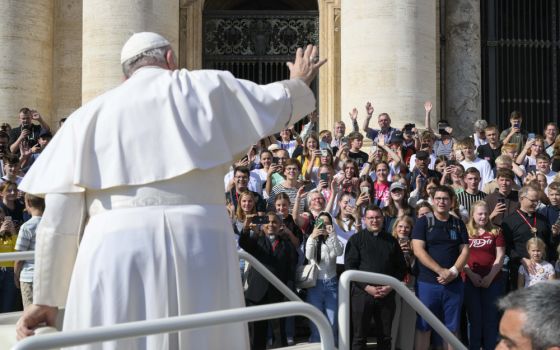 Pope Francis greets the crowd during his general audience in St. Peter's Square at the Vatican Oct. 12. (CNS/Vatican Media)