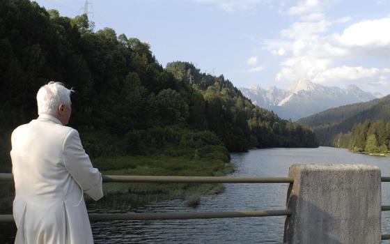 Pope Benedict XVI admires the scenery in Lorenzago di Cadore, Italy, while on vacation in the Alps July 23, 2007. (CNS/L'Osservatore Romano via Reuters)