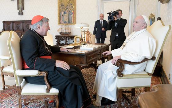 Pope Francis talks with Australian Cardinal George Pell during an audience Oct. 12, 2020, at the Vatican. (CNS/Vatican Media)