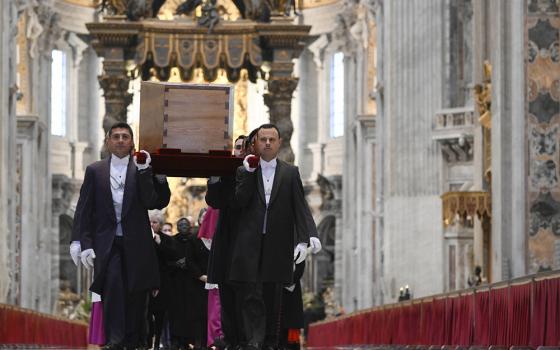 Pallbearers carry the casket of Pope Benedict XVI in St. Peter's Basilica during a procession to St. Peter's Square for the funeral of the late pope at the Vatican Jan. 5. (CNS/Vatican Media)