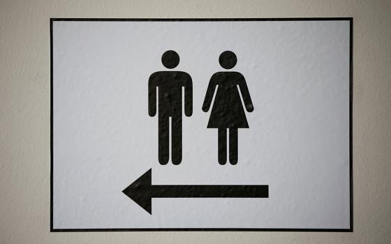 A sign illustrates men's and women's restrooms. (OSV News/Reuters/Wolfgang Rattay)