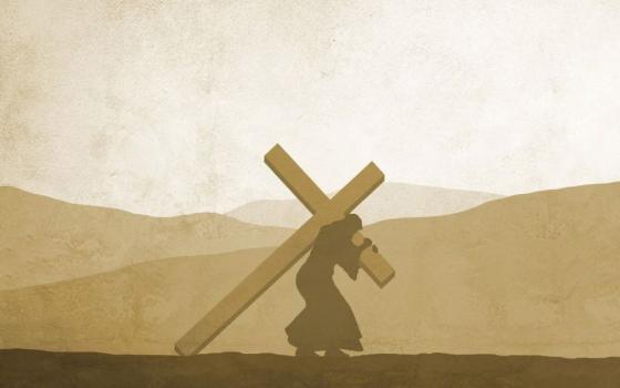 Jesus carries the cross.