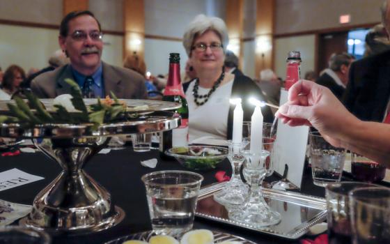 The Jewish Federation of Nashville and Middle Tennessee light candles April 12, 2016, at a community relations Seder at the Gordon Jewish Community Center in Nashville. (CNS/Tennessee Register/Rick Musacchio)
